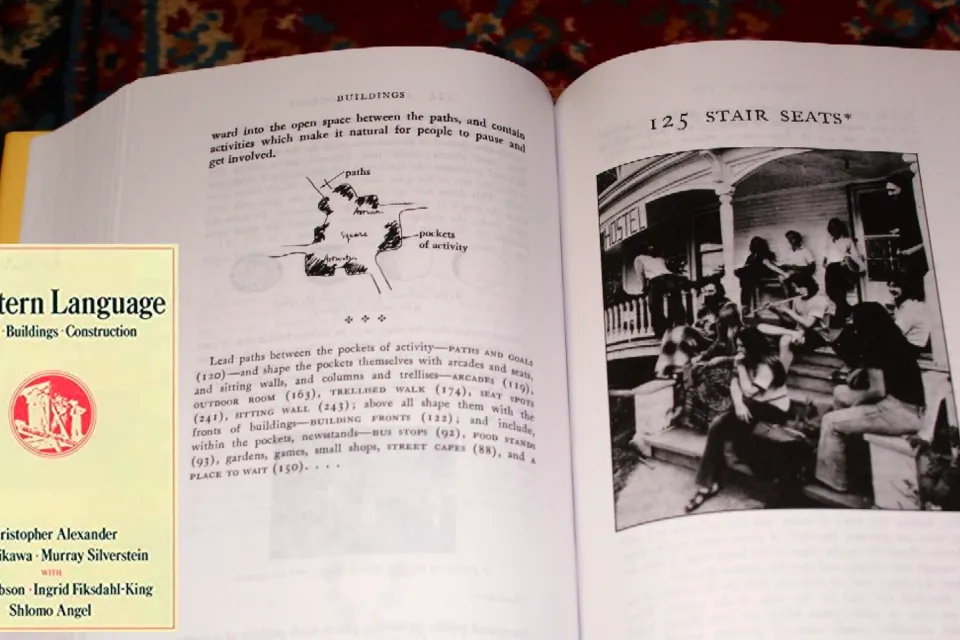 The cover of the book "A Pattern Language" by Christopher Alexander is shown next to a page from the booking--the latter shows "stair case steps."
